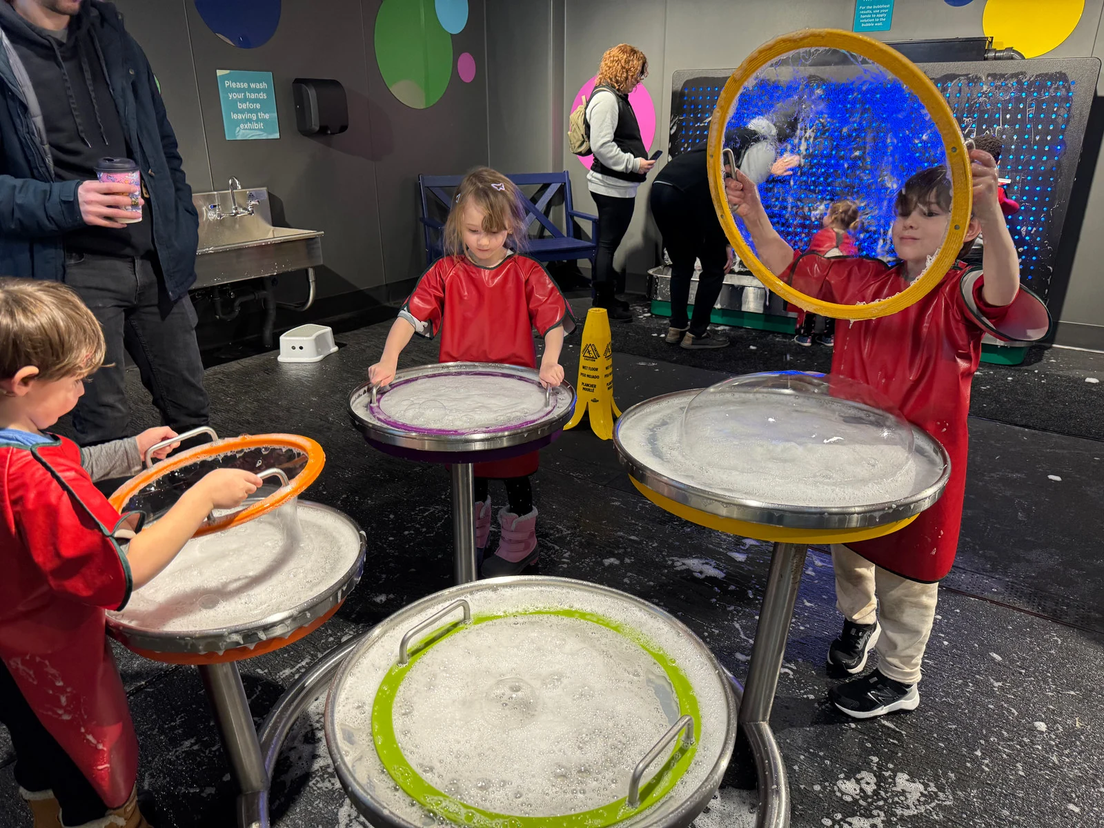 Wild Roots children experimenting with bubbles on a field trip